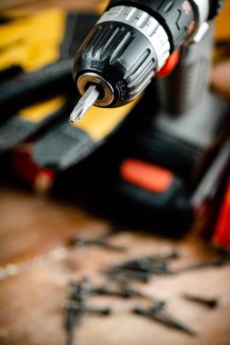 Working tool. Screwdriver. On a wooden background. High quality photo
