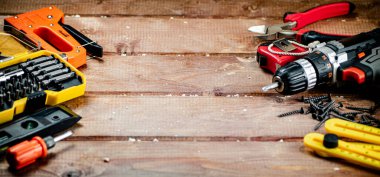 Working tools. Screwdriver bits. On a wooden background. High quality photo