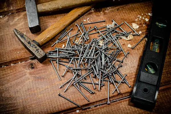 Hammer Bunch Nails Table Wooden Background High Quality Photo — Φωτογραφία Αρχείου