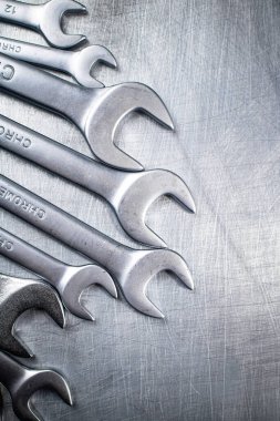 Metal wrench on the table. On a gray background. High quality photo
