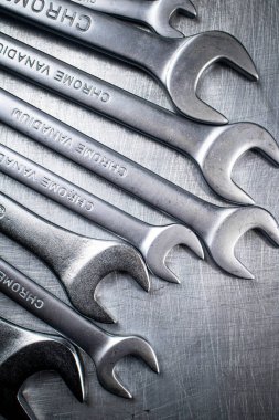 Metal wrench on the table. On a gray background. High quality photo