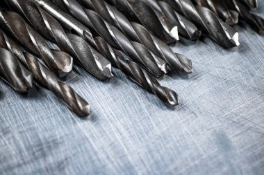 A bunch of drilled on the table. On a gray background. High quality photo