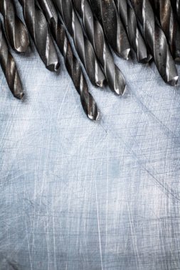 A bunch of drilled on the table. On a gray background. High quality photo
