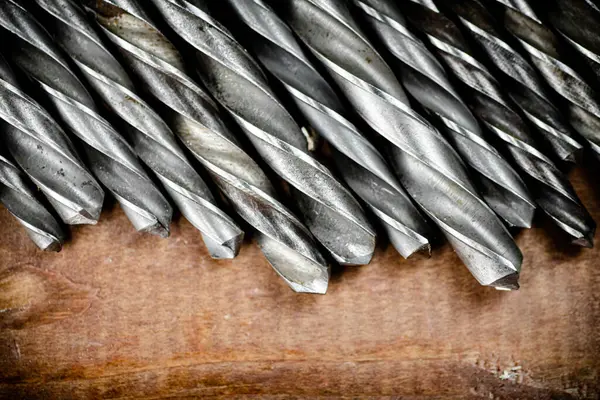 Drill Bits Drills Table Wooden Background High Quality Photo — Fotografia de Stock