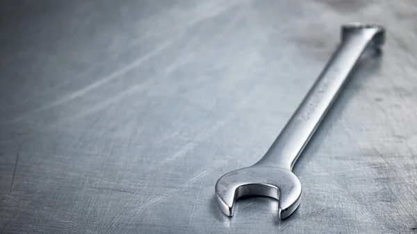 stock image Metal wrench on the table. On a gray background. High quality photo