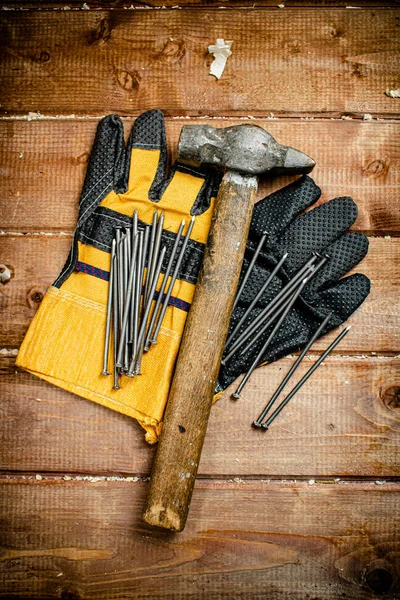 Nails Hammer Gloves Wooden Background High Quality Photo — Stock Fotó
