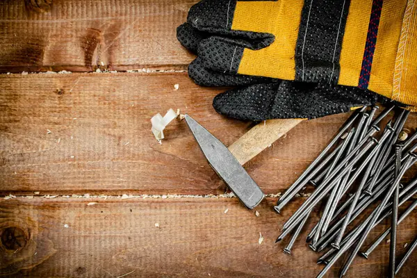 Nails Hammer Gloves Wooden Background High Quality Photo — Stock Fotó