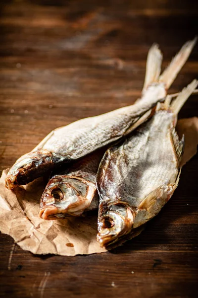 stock image Dried fish for beer. On wooden board.