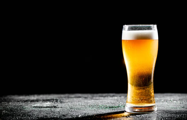 stock image Glass with beer . On rustic background.