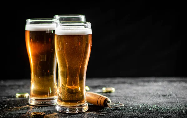 stock image Glasses with beer . On rustic background.