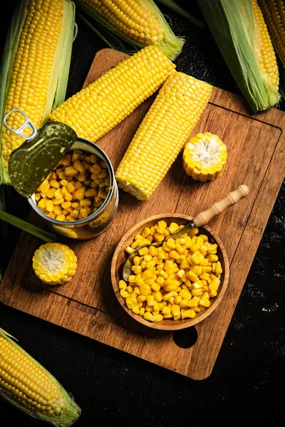 Canned corn on a board.