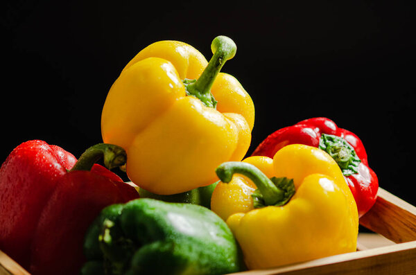 Fresh sweet pepper. On a wooden table.