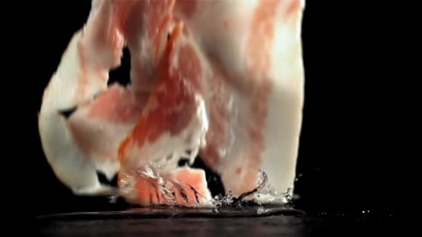 Fresh Bacon Falling Black Background Filmed High Speed Camera 1000 — Stock Video