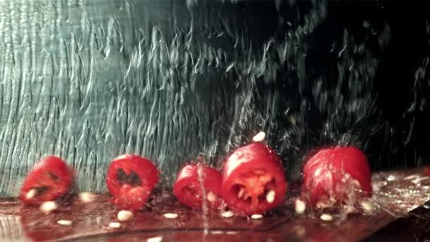 Knife Cuts Chili Pepper Splash Water Filmed High Speed Camera — Stock Video
