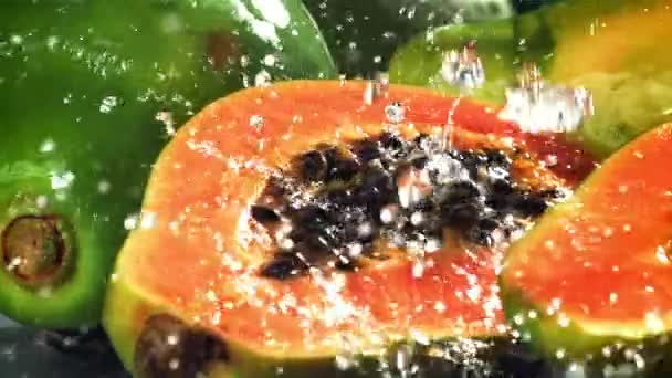 Fresh Tropical Papaya Drops Splashes Water Filmed High Speed Camera — Stock Video