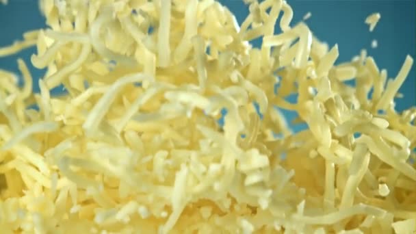 Shredded Cheese Flies Blue Background Filmed High Speed Camera 1000 — Stock Video