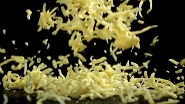 Shredded Cheese Falling Black Background Filmed High Speed Camera 1000 — Stock Video