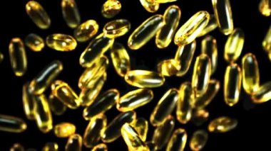 Süper yavaş çekimde Omega 3 vitamin kapsülleri yükselir ve düşer. Yüksek kaliteli FullHD görüntüler