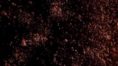 Kakao tozu yukarı aşağı uçuyor. 1000 fps 'de yüksek hızlı bir kamerayla çekildi. Yüksek kaliteli FullHD görüntüler