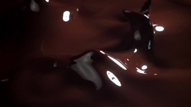 Dalgalar ve çikolata parçaları. 1000 fps 'de yüksek hızlı bir kamerayla çekildi. Yüksek kaliteli FullHD görüntüler