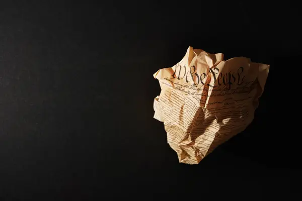 stock image Crumpled US Constitution on dark background