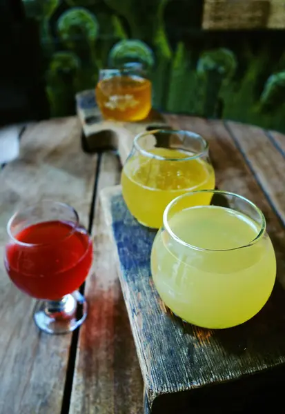 stock image Asheville, NC - USA - 08-05-2022: Craft beer flight on the patio of The Wicked Weed Funkatorium , specializing in sour and experimental beers