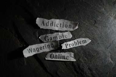 Problem online gambling and wagering newspaper headlines                                clipart