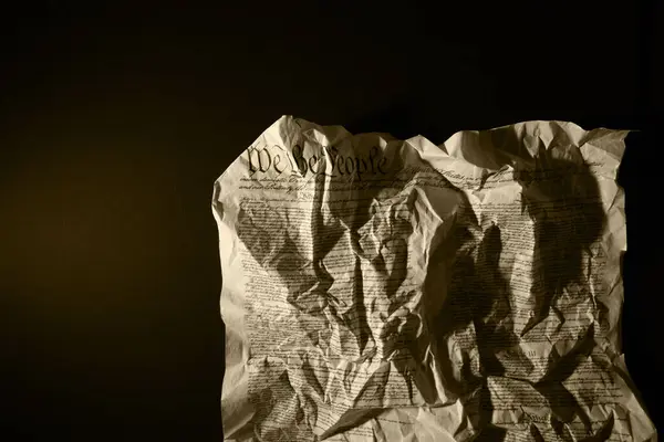 stock image Crumpled and wrinkled US Constitution on dark background