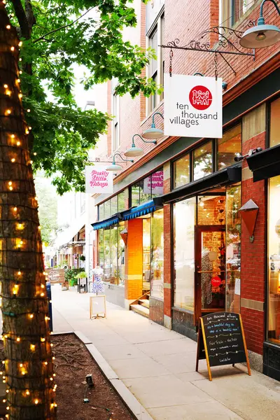 stock image Portsmouth, NH - USA - 08-08-2024: Ten Thousand Villages retail shop along a quiet street in historic downtown Portsmouth New Hampshire