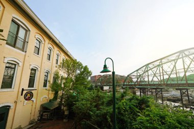 Topsham, ME - USA - 08-03-2024: Sea Dog Brewing company craft brewery and restaurant in the historic renovated Topsham Paper Company building clipart