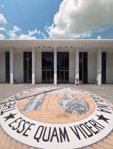 stock image Raleigh, NC - USA - 8-16-2024: The State Legislative building in downtown Raleigh NC, and the North Carolina state seal and motto, Esse Quam Videri