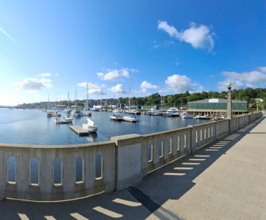 View of downtown Belfast, Maine with boats in the foreground clipart