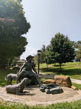 Boone, NC - USA - 09-09-2024: Daniel Boone statue on the campus of Appalachian State University clipart