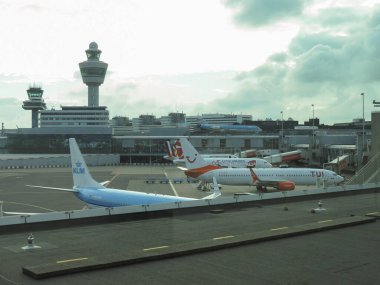 AMSTERDAM, NETHERLANDS - CIRCA AUGUST 2018: aircrafts by different companies parked at the airport