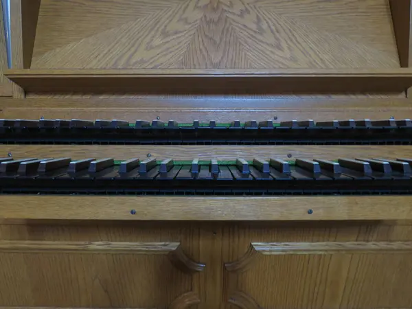 small church pipe organ keyboard music instrument - detail of keyboards