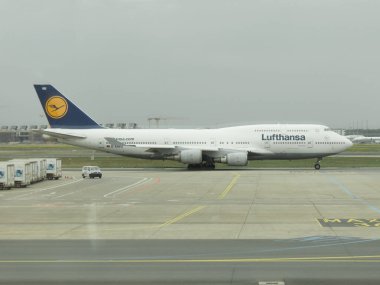 FRANKFURT AM MAIN, GERMANY - APRIL 24, 2022: Lufthansa Boeing 747 during taxi clipart