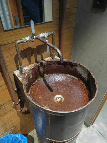 stock image industrial hipster sink and tap in a pub or restaurant toilet