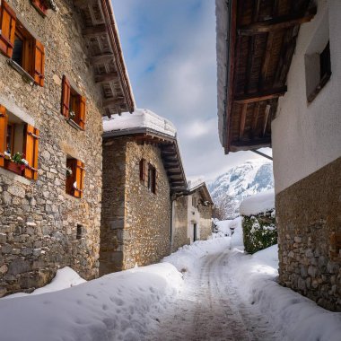 Alpine village covered with snow, AI generated image clipart