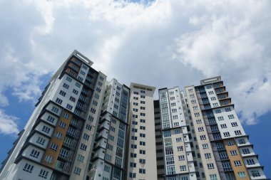 Cyberjaya, Malaysia-August 10, 2024; view of modern aparment building against blue sky, located at Cyberjaya, Malaysia clipart