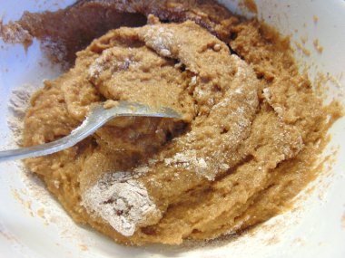 mixing ingredients for making cocoa flavoured dough
