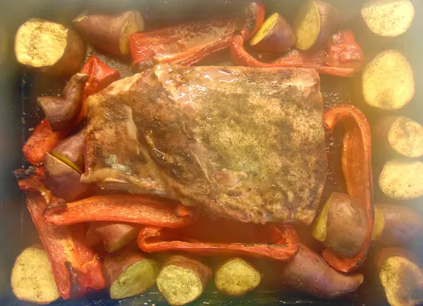 roast beef with vegetables in oven with steam