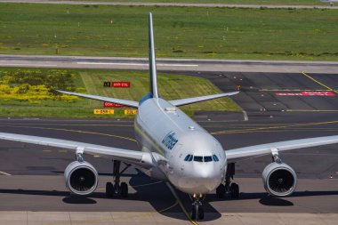 DUESSELDORF;GERMANY - 29: April 2024: Lufthansa Airbus A330 is taxiing to the gate clipart