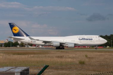 Frankfurt, Germany - 28 July 2010: Lufthansa Boeing B747 D-ABVB shortly before take-off at FRA clipart