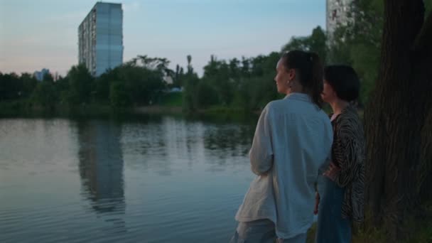 Two Women Enjoying Lake Landscape Girls Standing Together Chatting Female — Stock Video