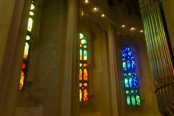 stock image Close up to a colored staineg glass with sunlight inside a sagrada familia cathedral 