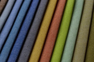 Close up to a beautiful upholstery cloth sample with diferent colors