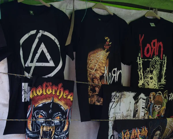 stock image rock bands stamped t shirts into a store of downtown flea market