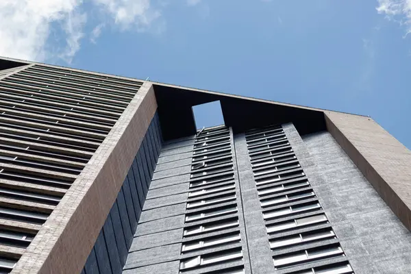 stock image Beautiful modern industrial style geometric residential brick building facade in sunny day