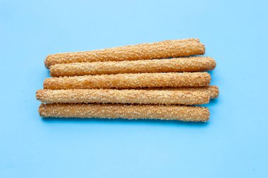 Bread sticks on blue background