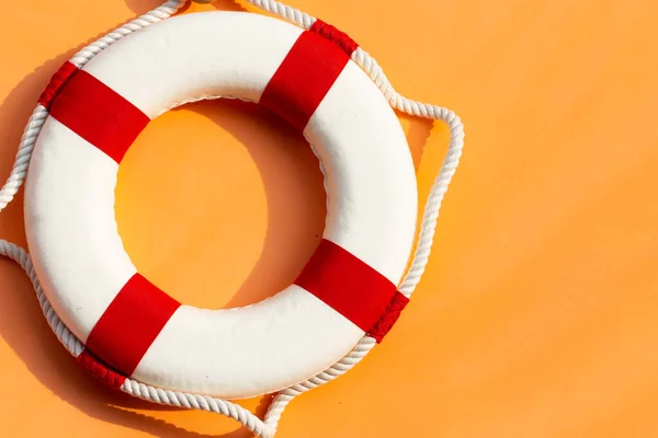 stock image Lifebuoy on orange background. Copy space